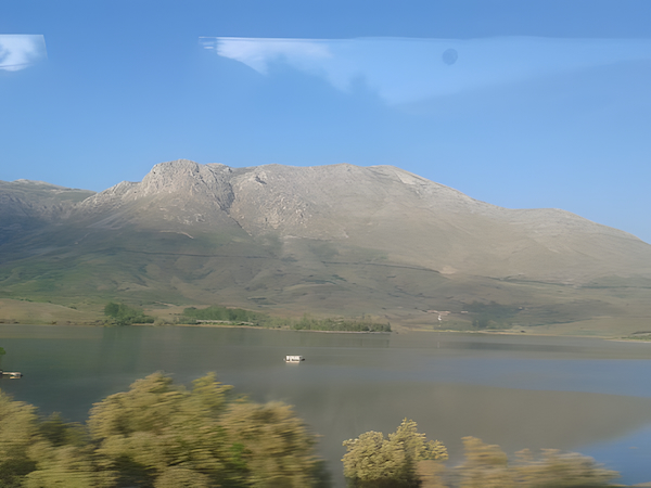 Calm lakeside under a sunny sky